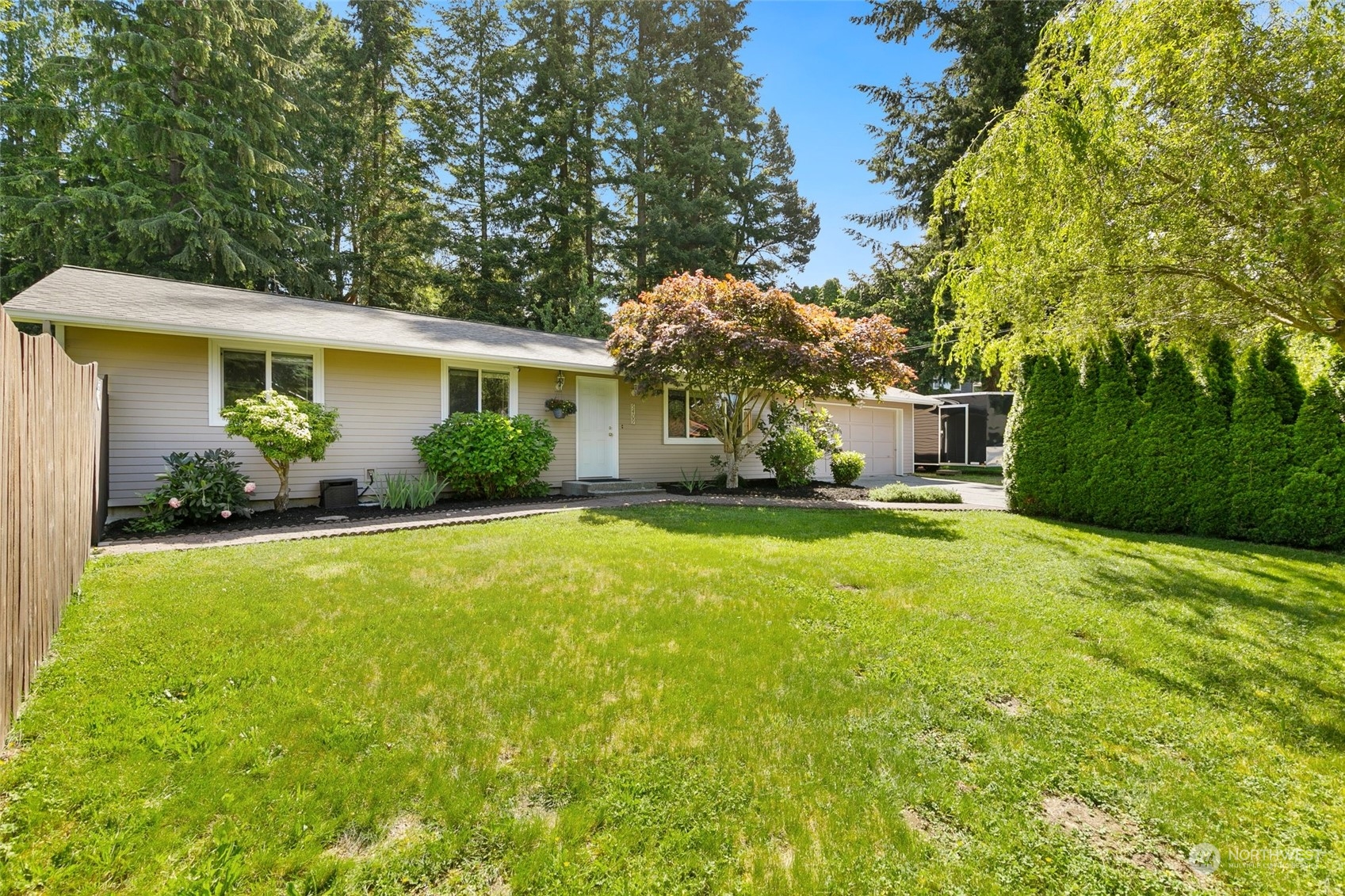 5409 Seahurst Avenue Everett, WA 98203 - Photo 3 of 26 a front view of a house with garden