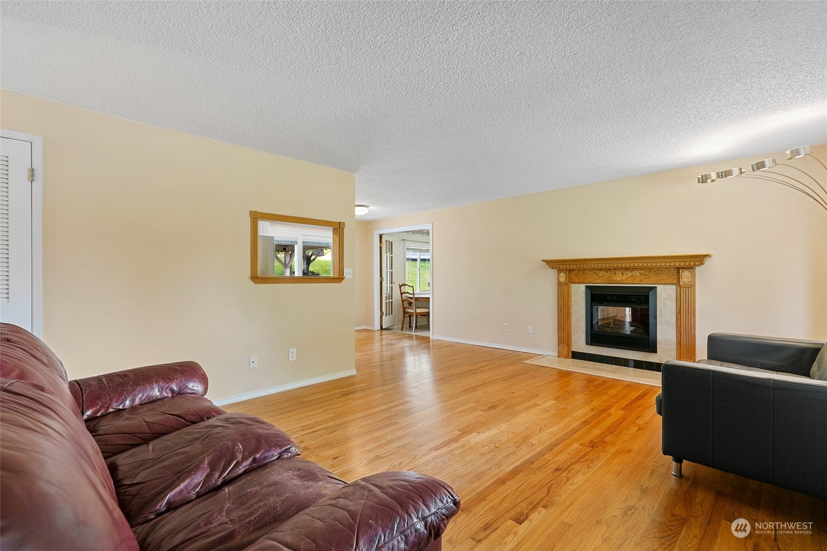 5409 Seahurst Avenue Everett, WA 98203 - Photo 5 of 26 a living room with a couch and a fireplace