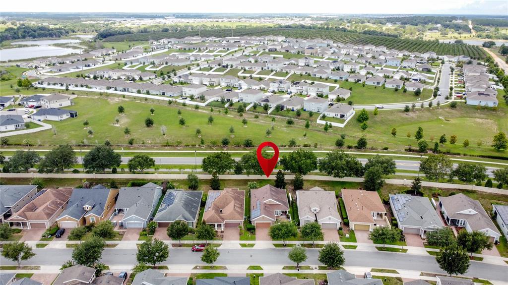 255 Silver Maple Road Groveland, FL 34736 - Photo 3 of 68 an aerial view of residential building and lake view