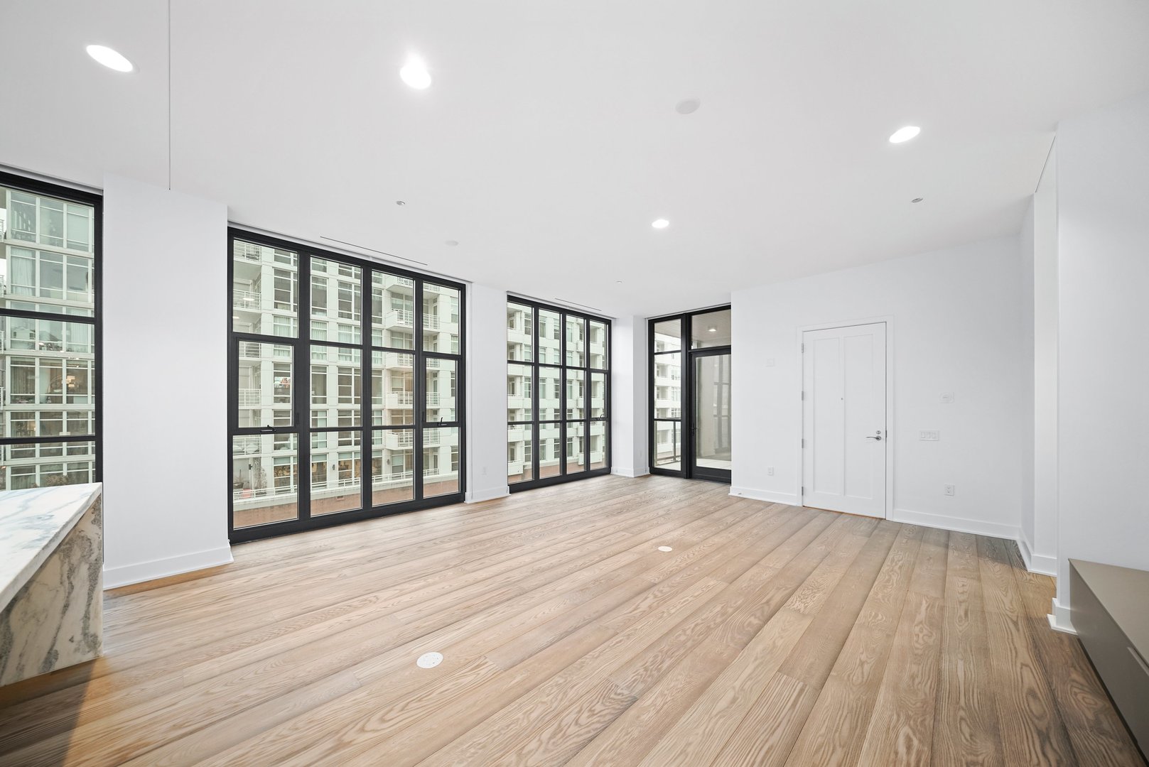 900 West Washington Boulevard, Unit 504 Chicago, IL 60607 - Photo 11 of 28 wooden floor in an empty room with a window