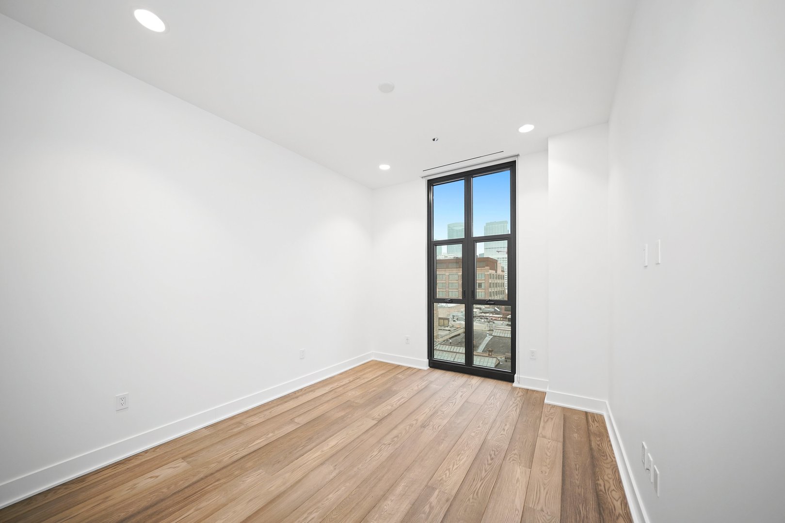 900 West Washington Boulevard, Unit 504 Chicago, IL 60607 - Photo 18 of 28 an empty room with wooden floor and window