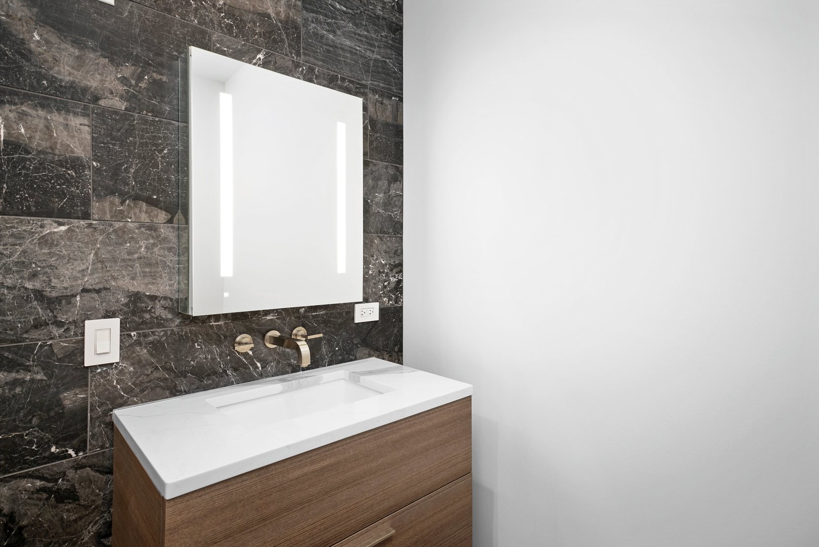 900 West Washington Boulevard, Unit 504 Chicago, IL 60607 - Photo 21 of 28 a bathroom with a sink and a mirror