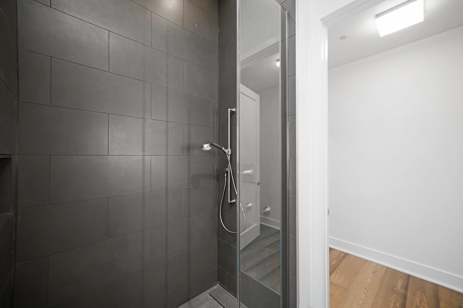 900 West Washington Boulevard, Unit 504 Chicago, IL 60607 - Photo 27 of 28 a bathroom with a glass shower door
