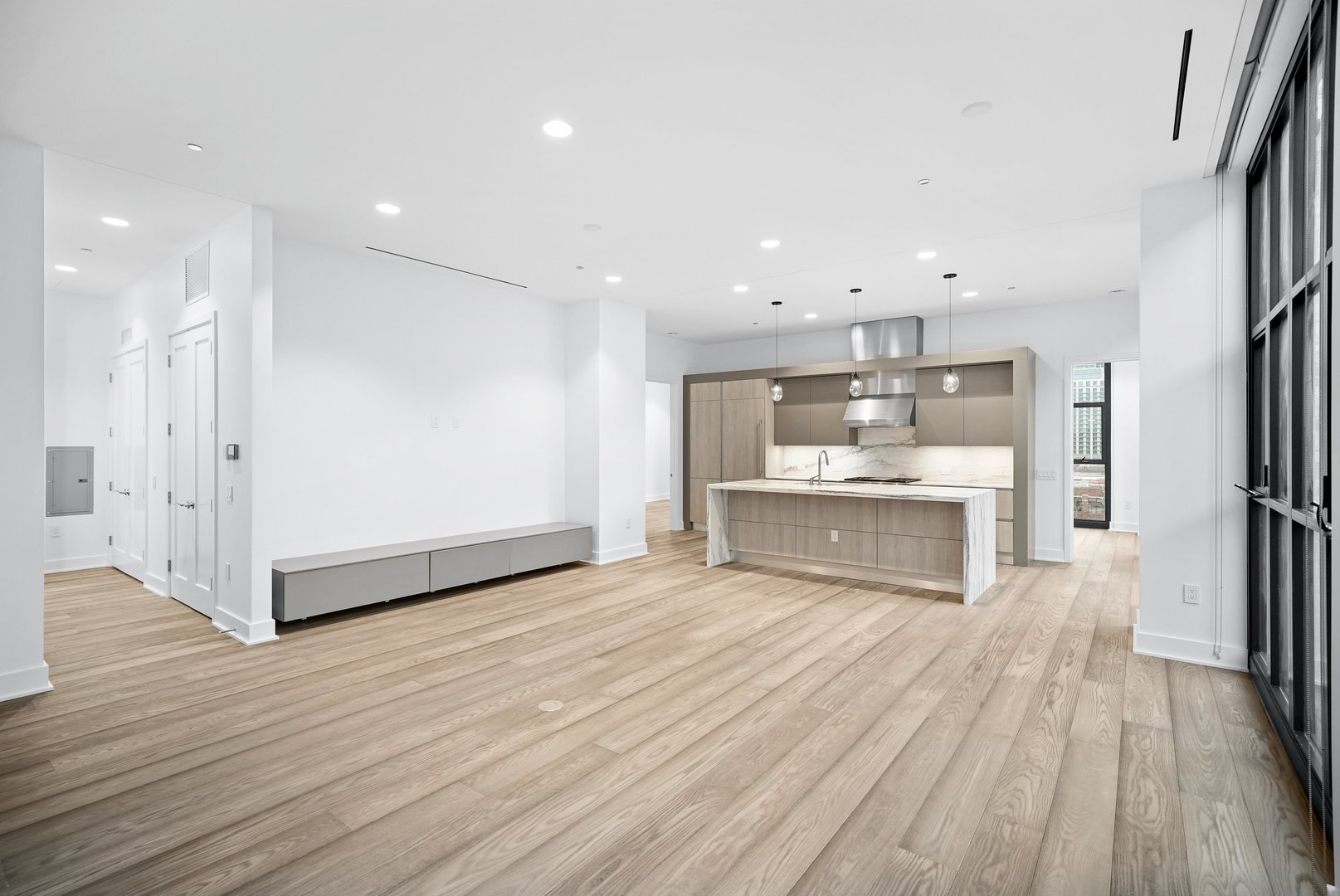 900 West Washington Boulevard, Unit 504 Chicago, IL 60607 - Photo 4 of 28 a view of a kitchen with wooden floor