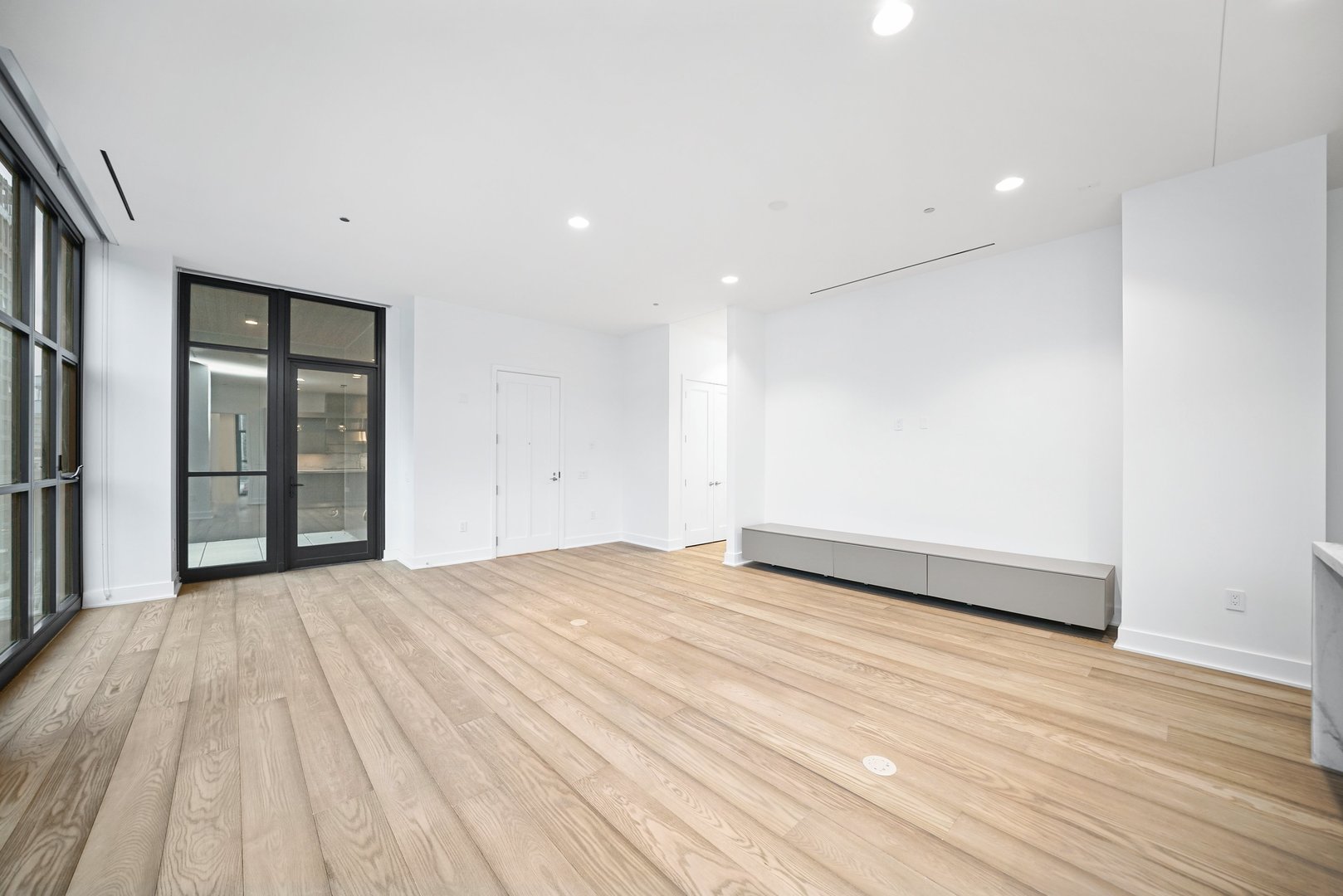 900 West Washington Boulevard, Unit 504 Chicago, IL 60607 - Photo 8 of 28 a view of an empty room with wooden floor and closet