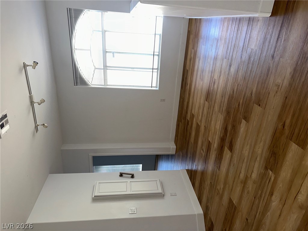 2050 West Warm Springs Road, Unit 1323 Henderson, NV 89014 - Photo 2 of 10 Luminous interior with high ceilings and rich hardwood flooring awaits a personal touch.