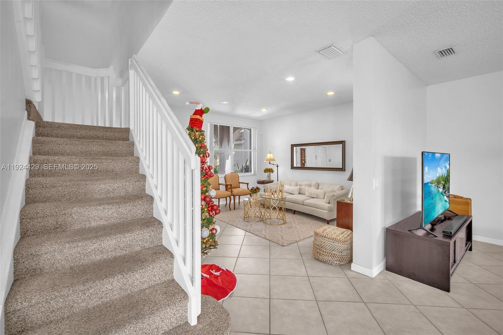 1058 Tupelo Way Weston, FL 33327 - Photo 20 of 43 a view of a living room and entryway