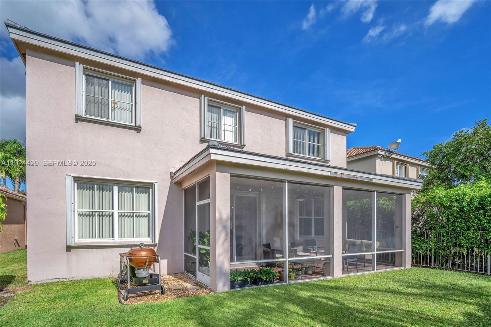 1058 Tupelo Way Weston, FL 33327 - Photo 3 of 43 front view of a house with a yard