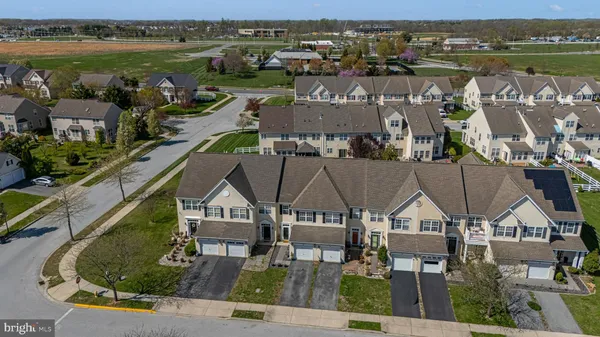 an aerial view of a house with a lake view