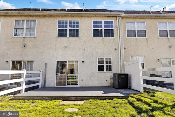 a view of front door of house with wooden floor