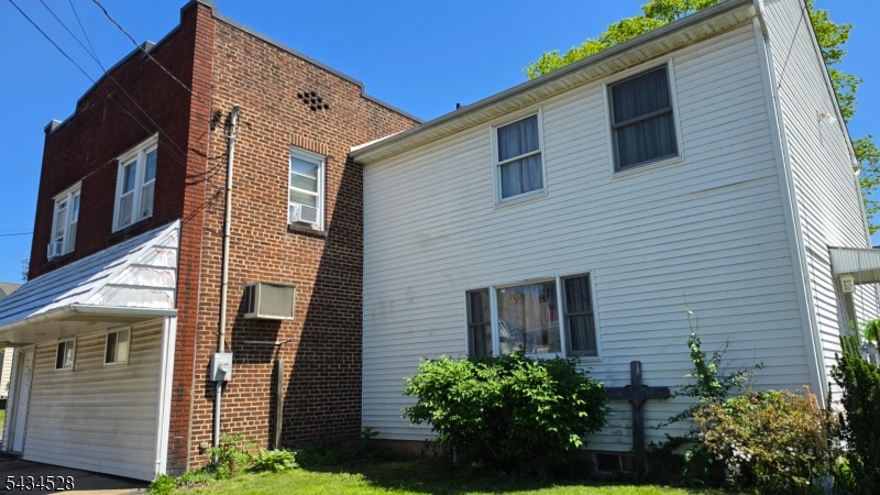 1115 West Camplain Road Manville, NJ 08835 - Photo 1 of 18 a view of a house with a yard