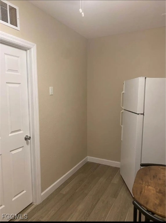 5230 32nd Avenue Southwest Naples, FL 34116 - Photo 4 of 11 a view of a storage & utility room with a refrigerator