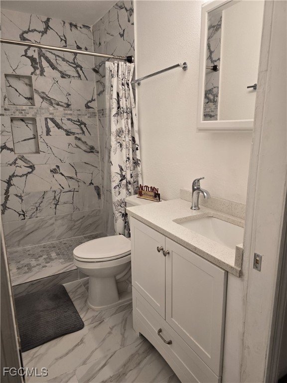 5230 32nd Avenue Southwest Naples, FL 34116 - Photo 9 of 11 a bathroom with a toilet sink and shower