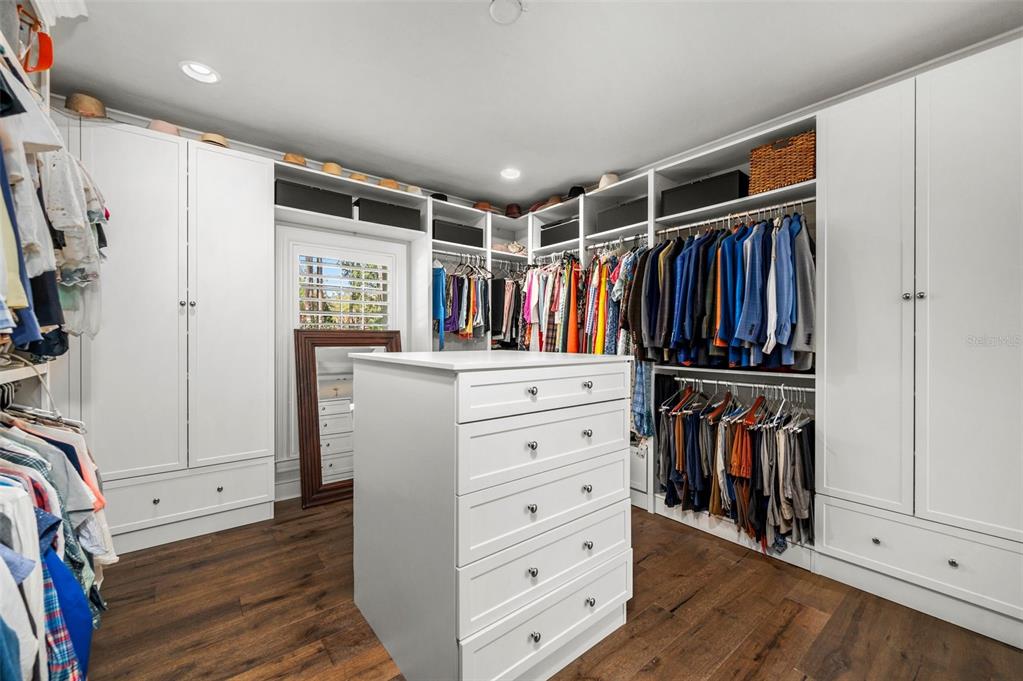 623 Southwest 93rd Street Gainesville, FL 32607 - Photo 38 of 100 a view of walk in closet with clothes and shoes