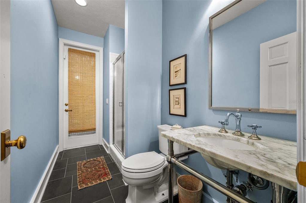 623 Southwest 93rd Street Gainesville, FL 32607 - Photo 56 of 100 a bathroom with a sink and a mirror