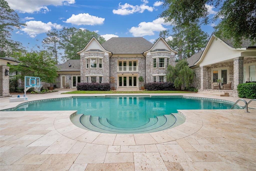 623 Southwest 93rd Street Gainesville, FL 32607 - Photo 87 of 100 a view of a house with a swimming pool