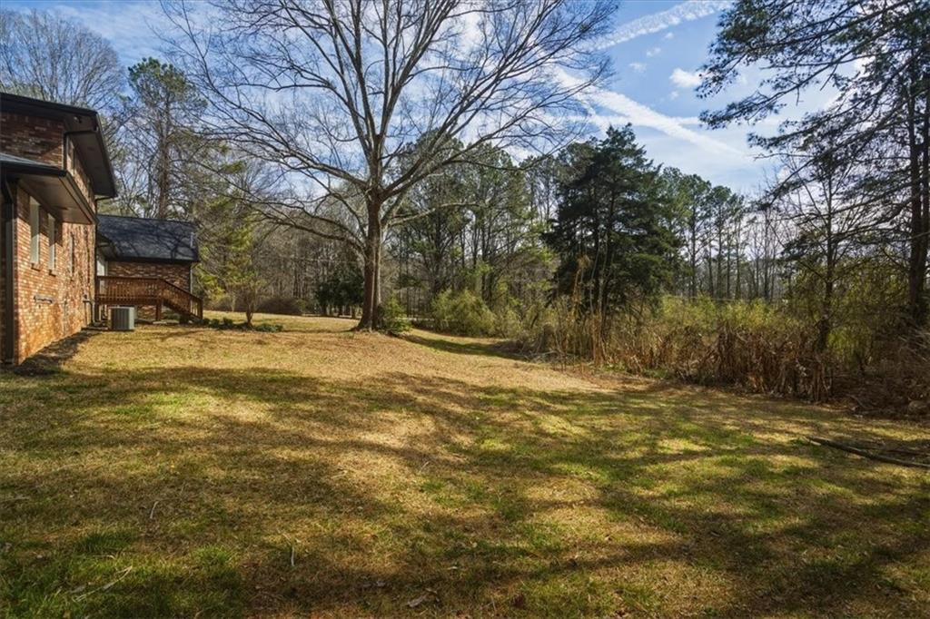 4911 Lower Jersey Road Oxford, GA 30054 - Photo 41 of 56 a view of road with large trees