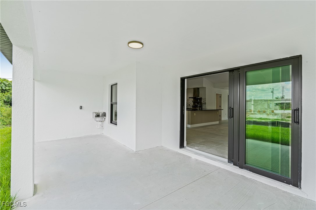 3310 3rd Street Southwest Lehigh Acres, FL 33976 - Photo 22 of 23 a view of a big room with windows and entryway