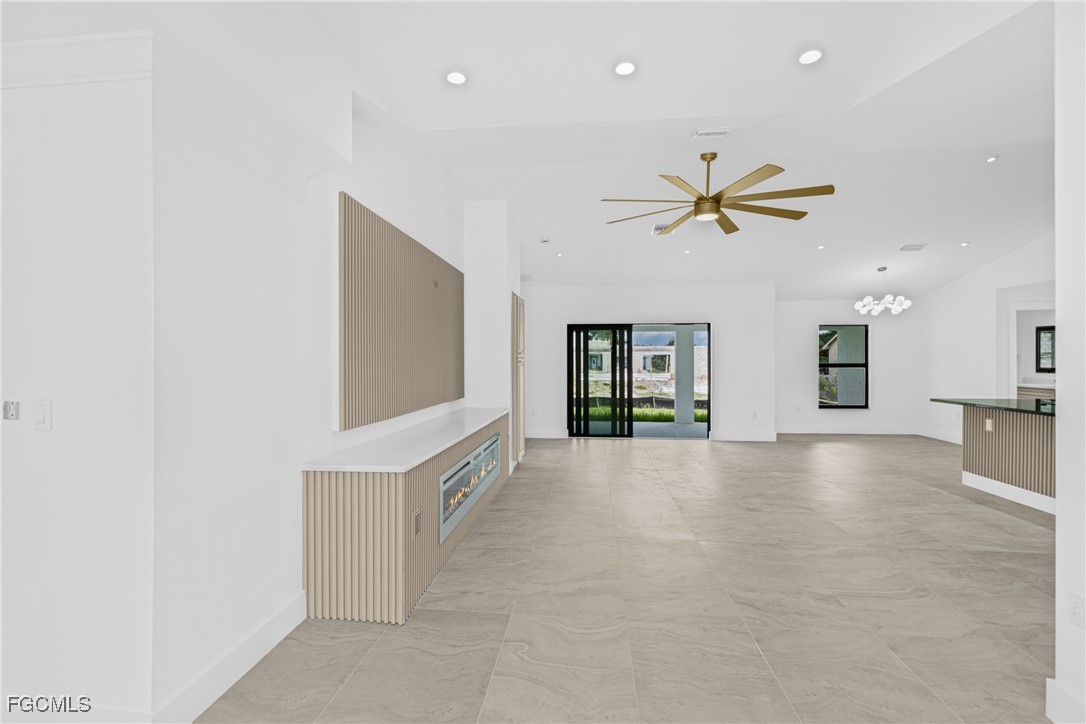 3310 3rd Street Southwest Lehigh Acres, FL 33976 - Photo 3 of 23 a view of an empty room with a window