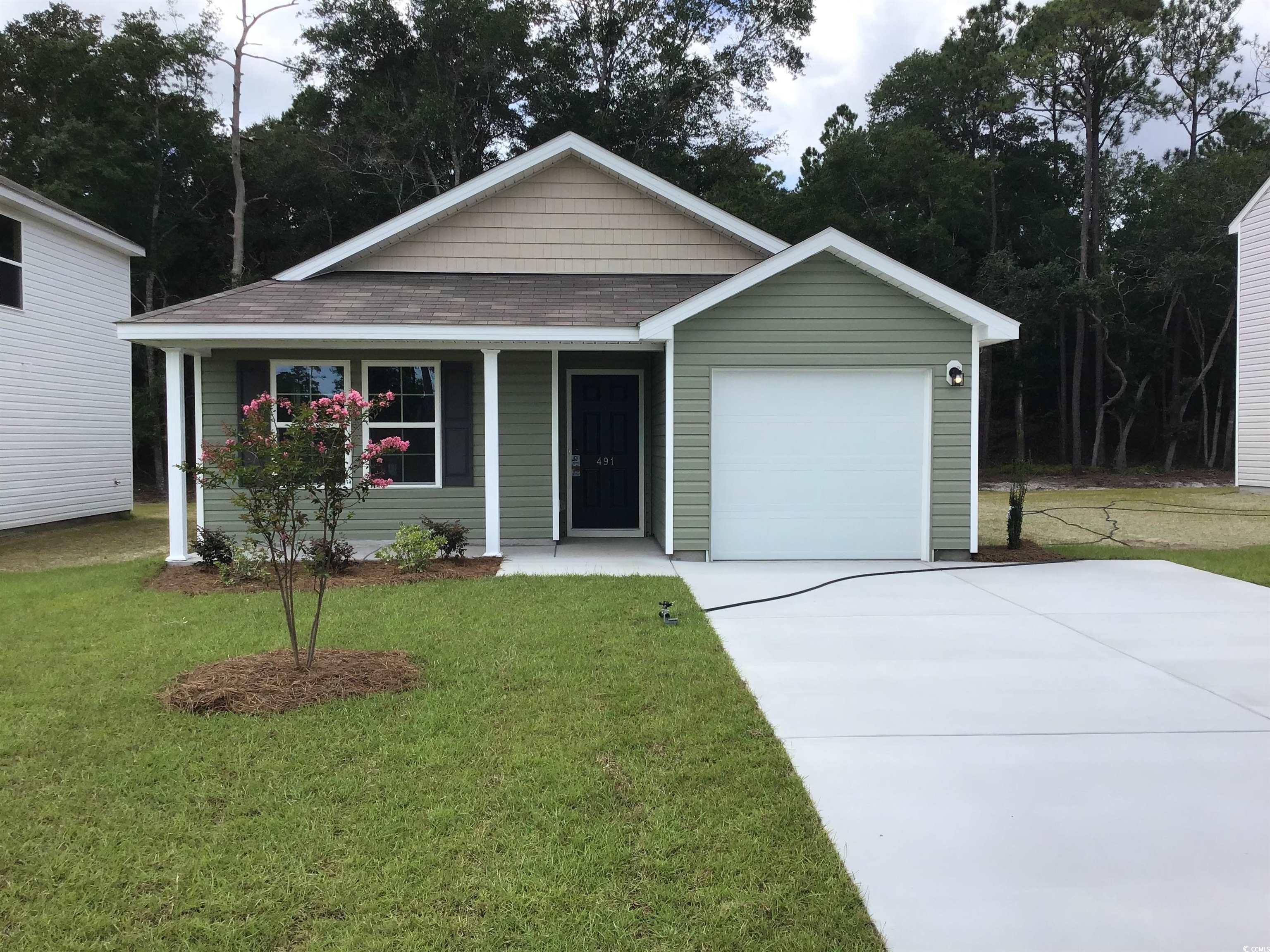 491 Southwest Hewett Lndg Drive Columbia, SC 29209 - Photo 1 of 3 View of front facade with a porch, a front lawn, a