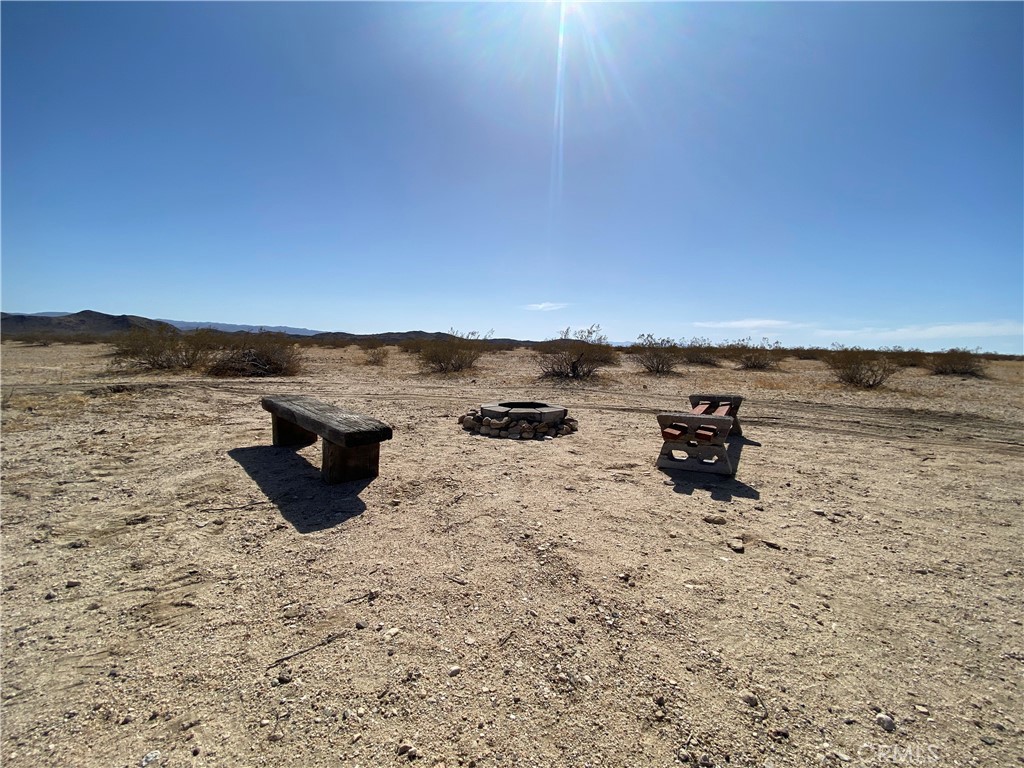 0 Windsong Joshua Tree, CA 92252 - Photo 4 of 6 a view of an ocean beach and an outdoor seating
