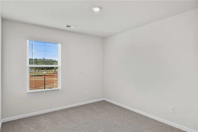 a bathroom with a double vanity sink toilet and a mirror