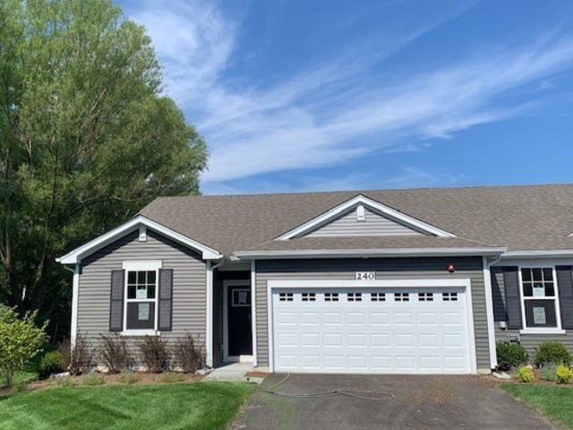 929 Darwin Street North Aurora, IL 60542 - Photo 1 of 42 a front view of a house with a yard and garage