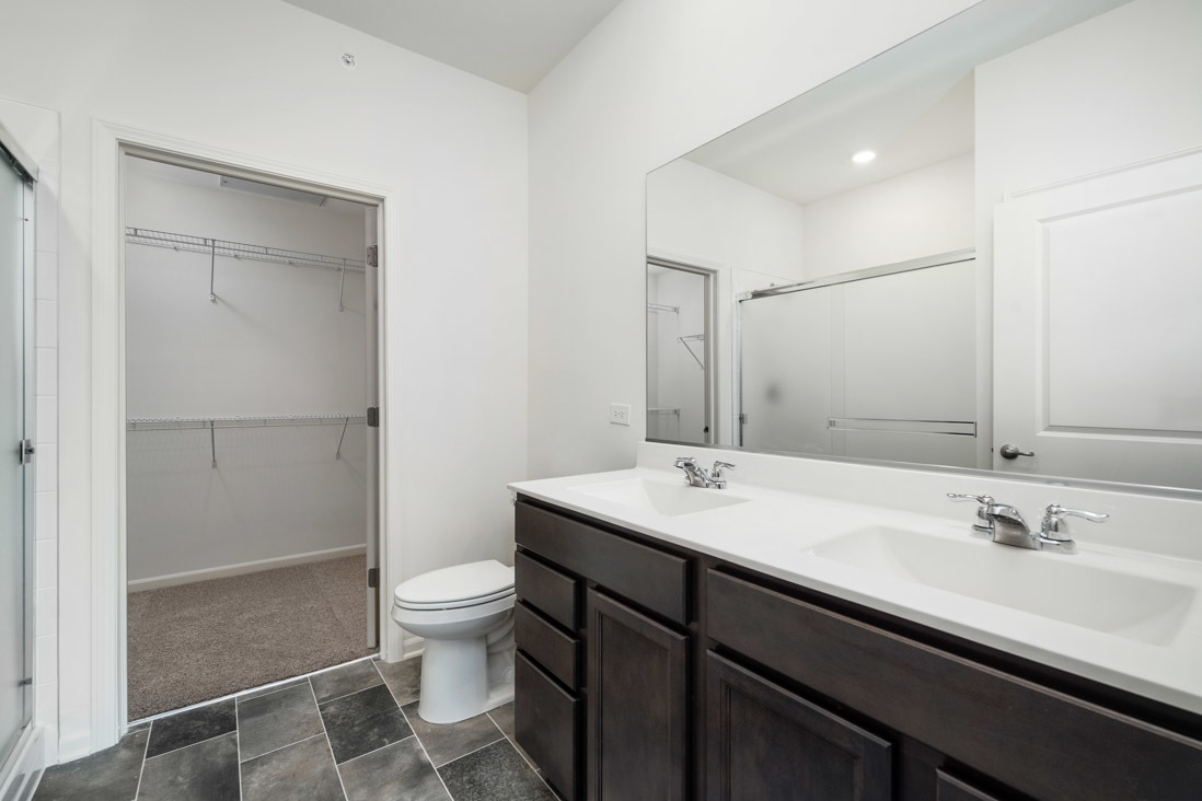 929 Darwin Street North Aurora, IL 60542 - Photo 15 of 42 a bathroom with a sink a toilet and shower
