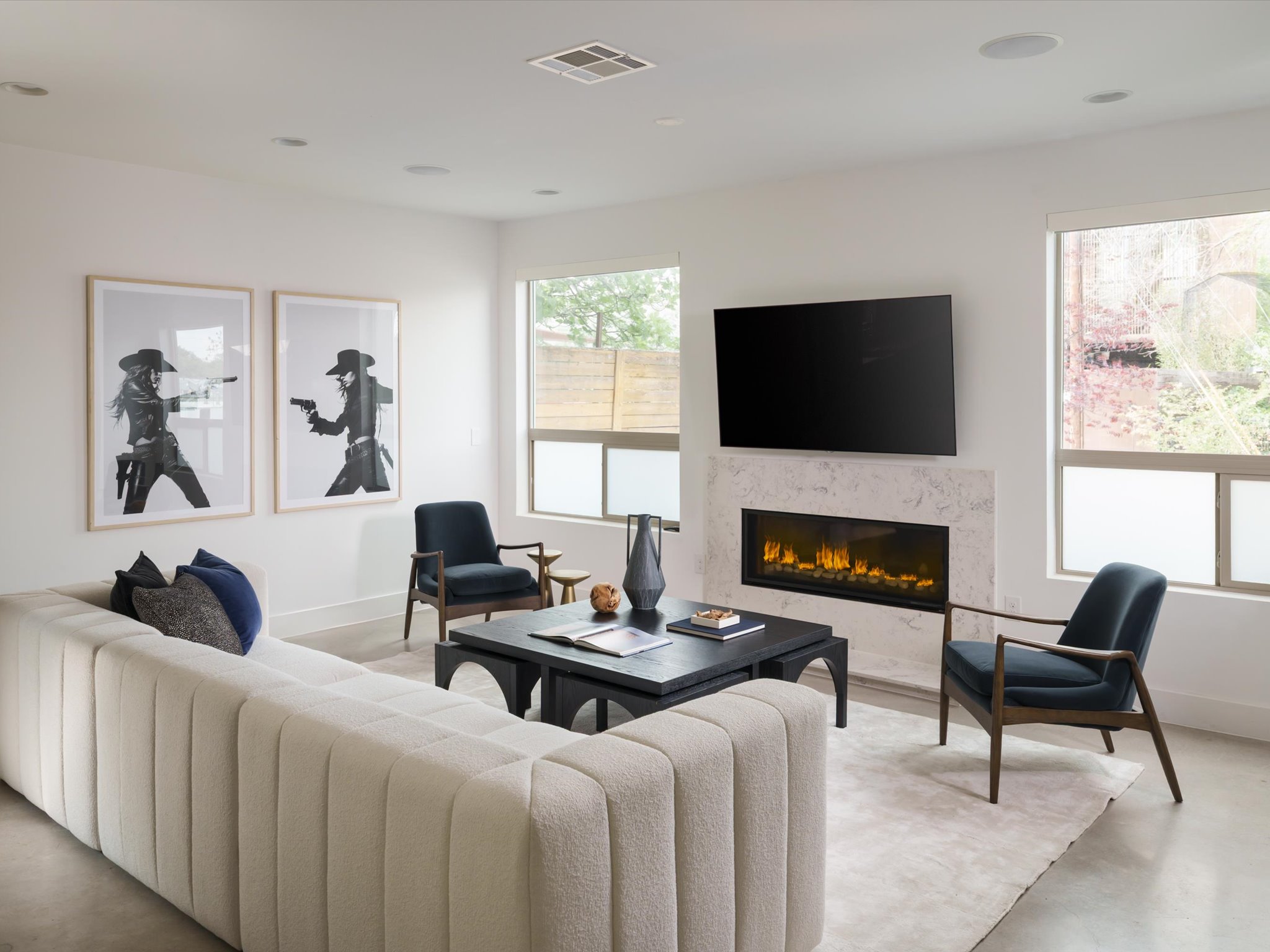 615 Jewell Street Austin, TX 78704 - Photo 3 of 25 The main living room glows with a gas fireplace and immersive surround sound - ready for dinner parties or low-key nights in.