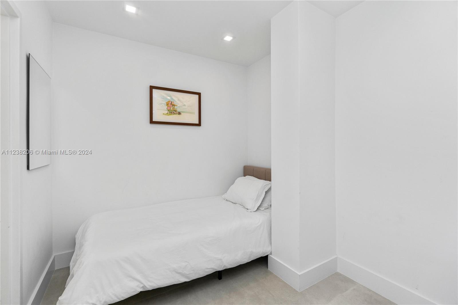 100 Lincoln Road, Unit 1608 Miami Beach, FL 33139 - Photo 11 of 22 a bathroom with a white wall and a shower