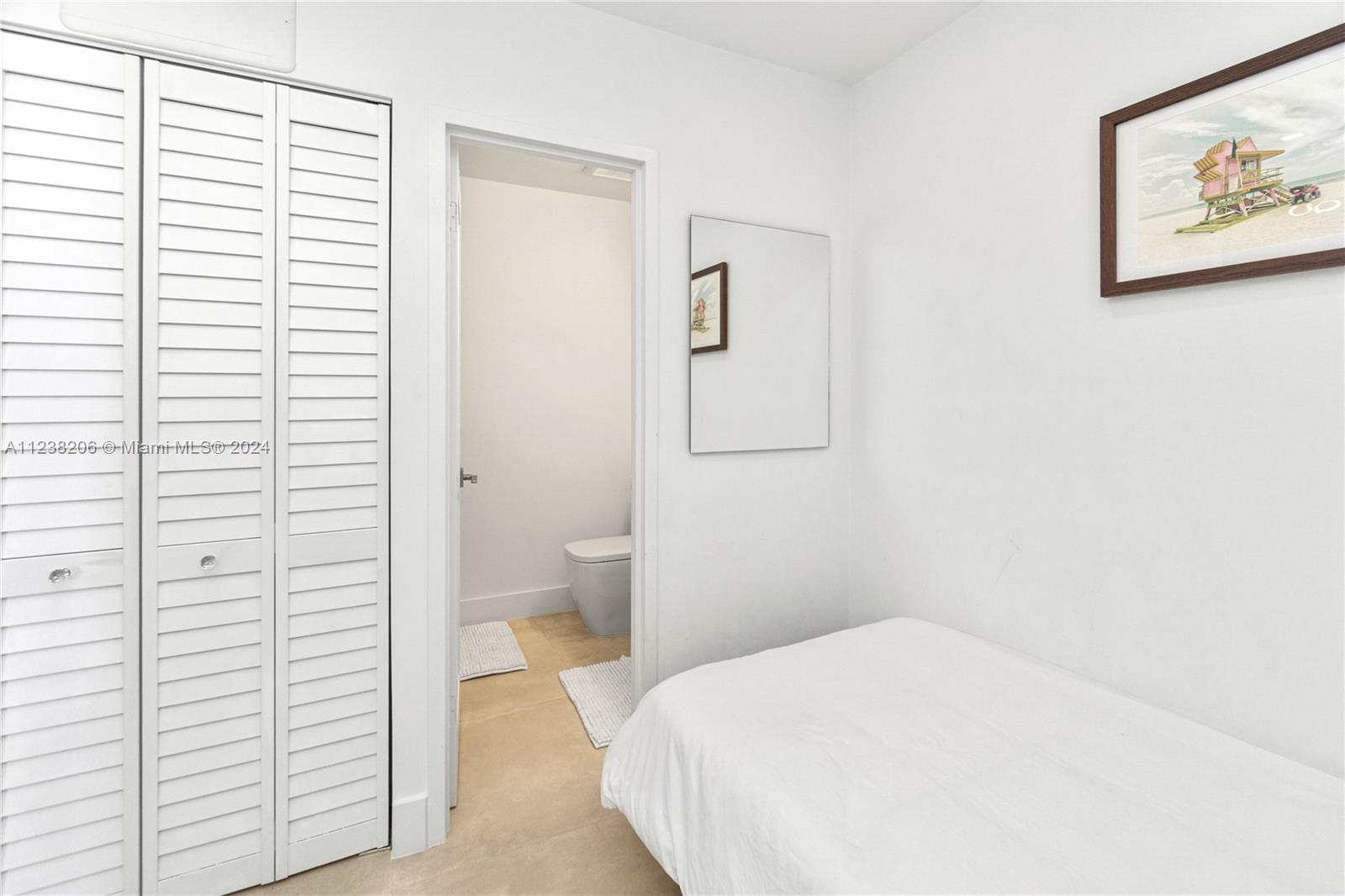 100 Lincoln Road, Unit 1608 Miami Beach, FL 33139 - Photo 12 of 22 a bathroom with a sink and a toilet