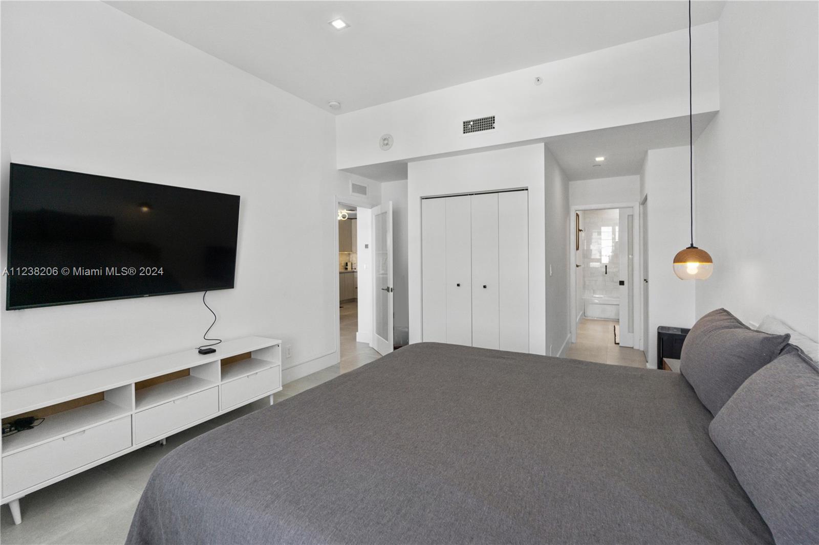 100 Lincoln Road, Unit 1608 Miami Beach, FL 33139 - Photo 16 of 22 a living room with furniture and a flat screen tv