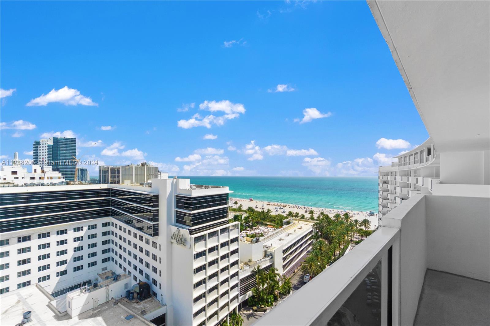 100 Lincoln Road, Unit 1608 Miami Beach, FL 33139 - Photo 20 of 22 a view of a balcony with two chairs and a swing