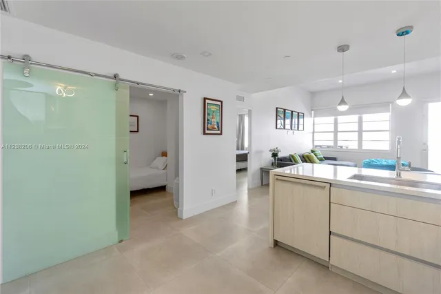 a kitchen with sink and cabinets