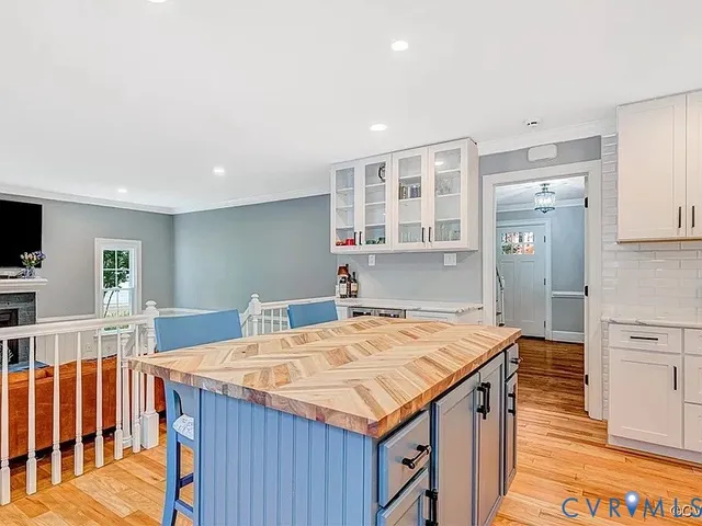 a kitchen that has a table and chairs in it