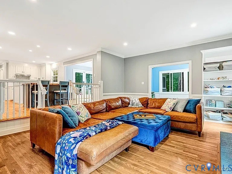 13904 Sunrise Bluff Road Midlothian, VA 23112 - Photo 16 of 45 Living room featuring ornamental molding, wood fin