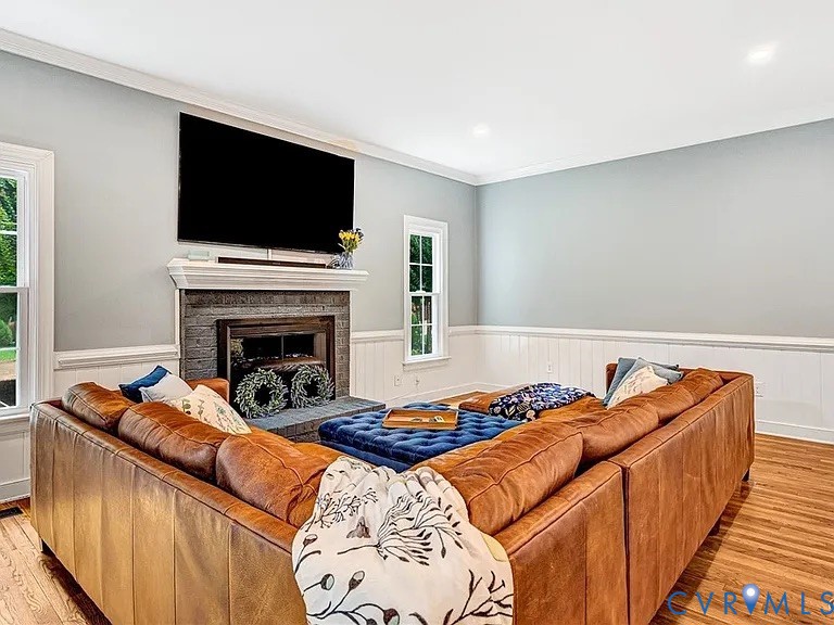 13904 Sunrise Bluff Road Midlothian, VA 23112 - Photo 17 of 45 Living area featuring light wood-style floors, a w