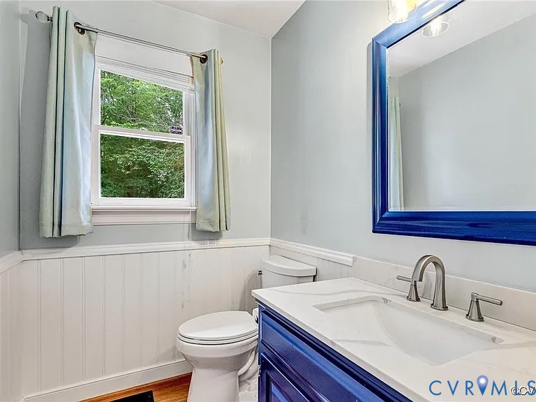 13904 Sunrise Bluff Road Midlothian, VA 23112 - Photo 20 of 45 Bathroom with wainscoting, vanity, and wood finish