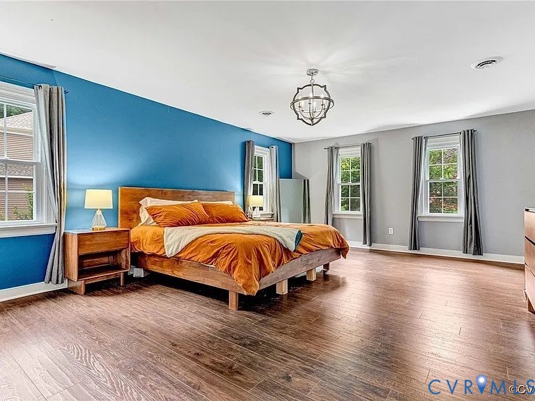 13904 Sunrise Bluff Road Midlothian, VA 23112 - Photo 21 of 45 Bedroom featuring wood-type flooring and a chandel