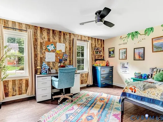 a bedroom with furniture and a window
