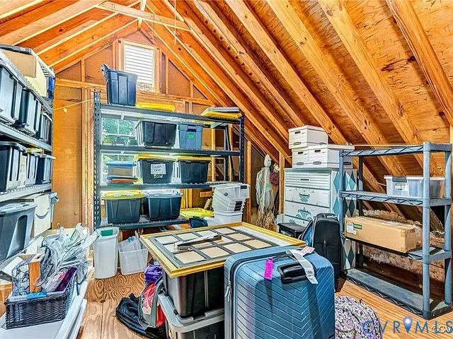 a utility room with multiple dryer and washer