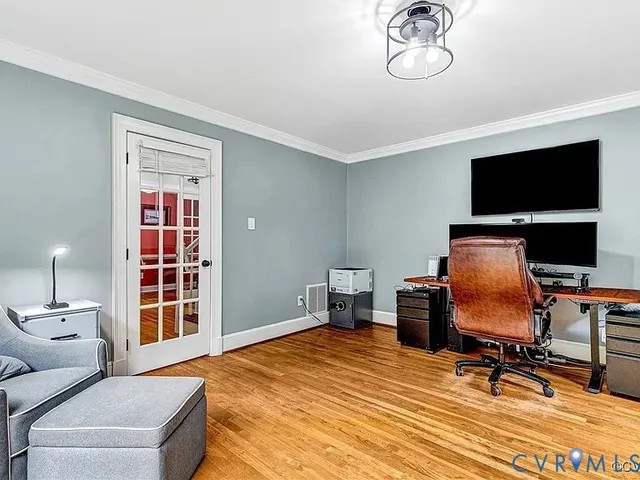 a bedroom with a workspace