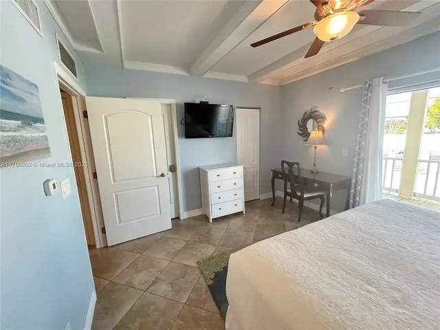 a bed room with a bed and a night stand