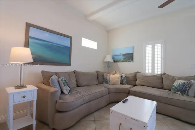 a kitchen with stainless steel appliances granite countertop white cabinets and a stove top oven