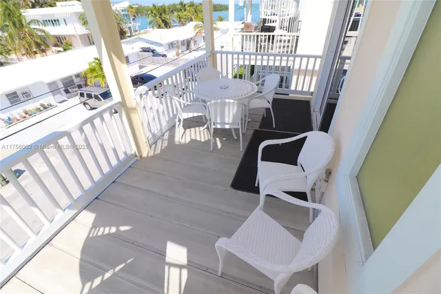 a lake view with boat and palm trees