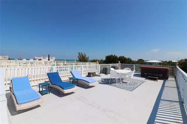 a view of a balcony with an ocean view