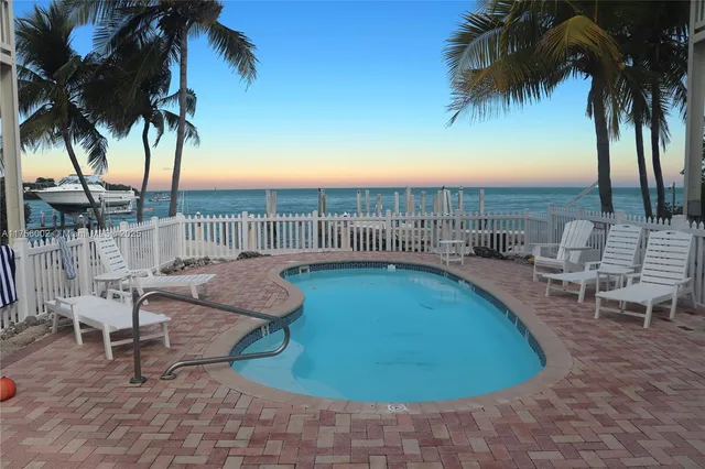 a view of a swimming pool with a lounge chair
