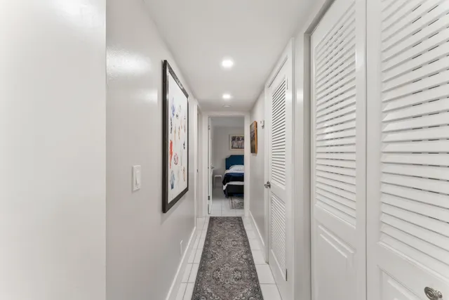 a view of a hallway with white walls