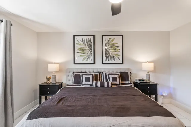 a bedroom with furniture and window