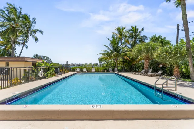 a view of a garden with a building in the background